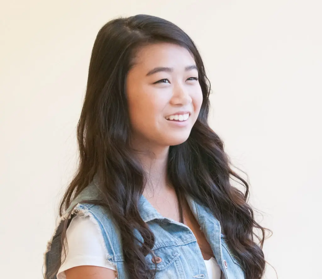 a woman smiling with long hair