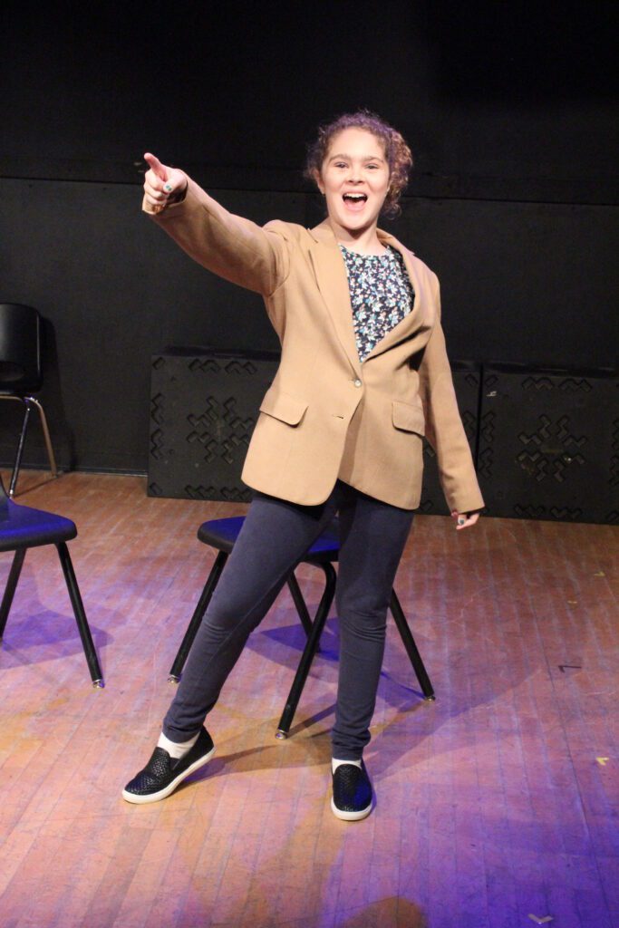 a girl pointing at something