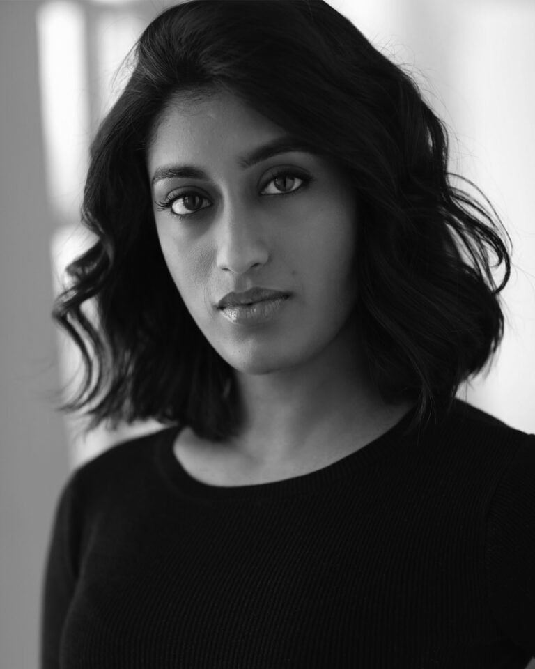 Headshot of Uma Paranjpe, actress, in black and white.