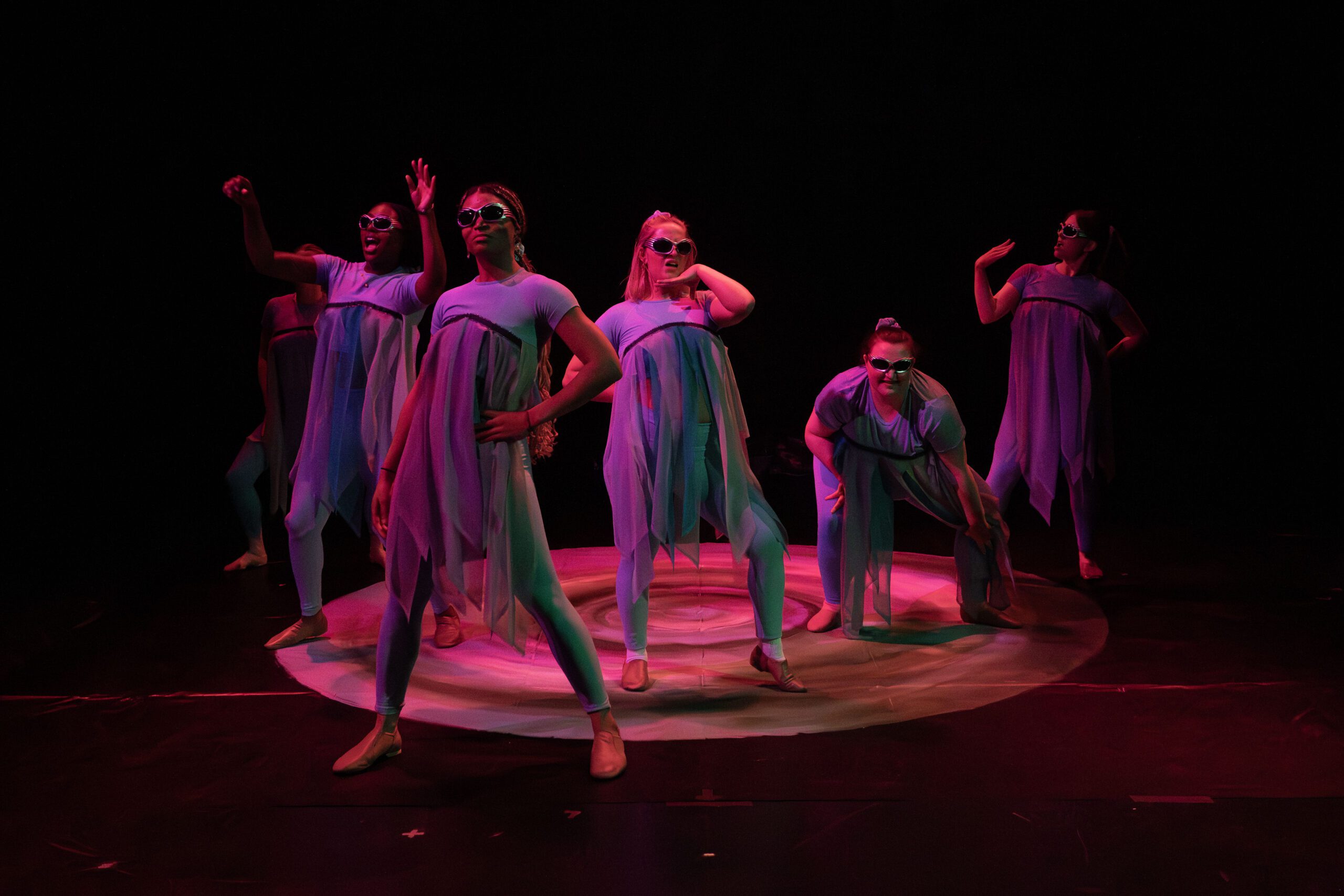a group of women dancing on a stage