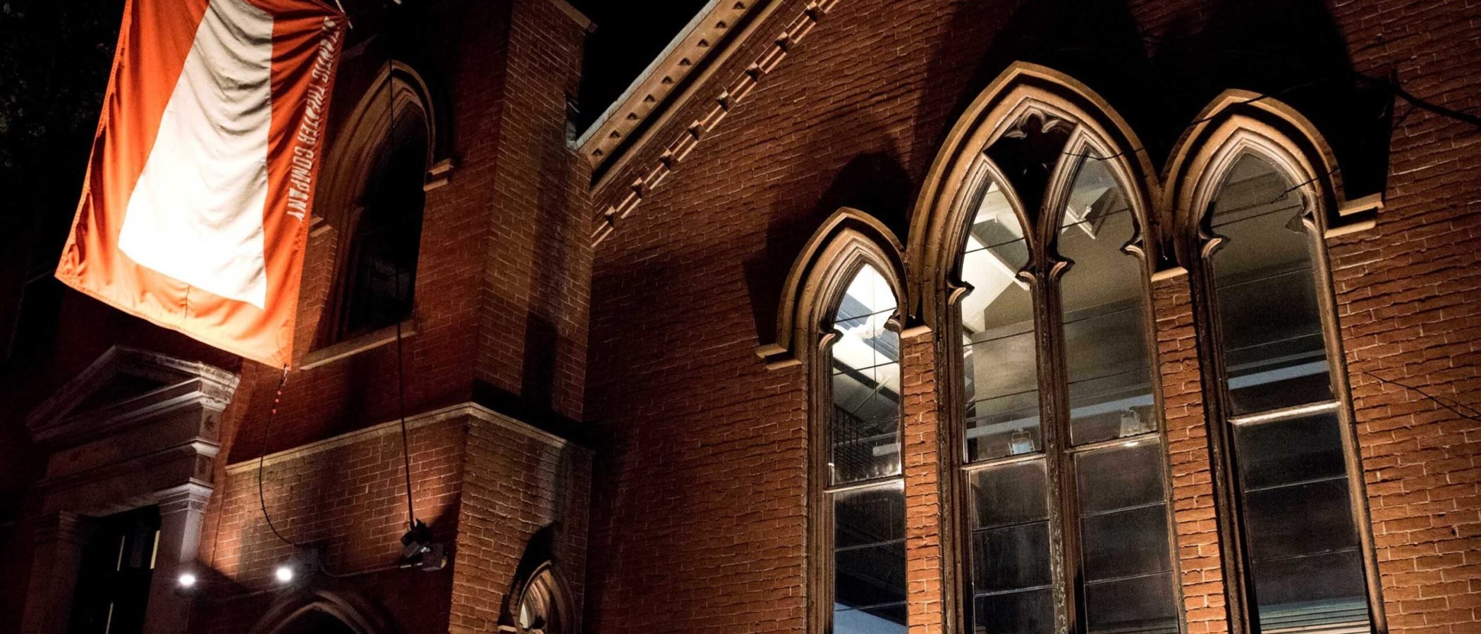 a building with a flag on the side