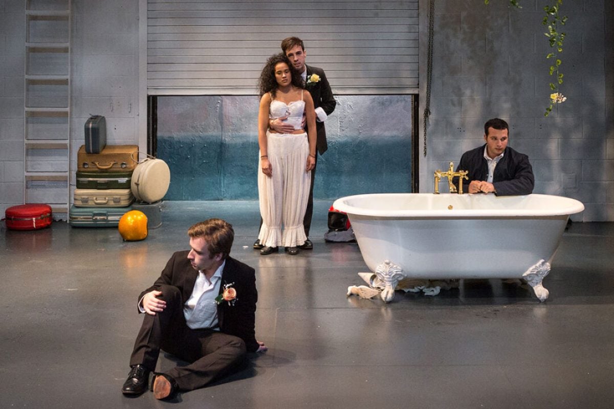 Theater production scene with actors in a modern setting