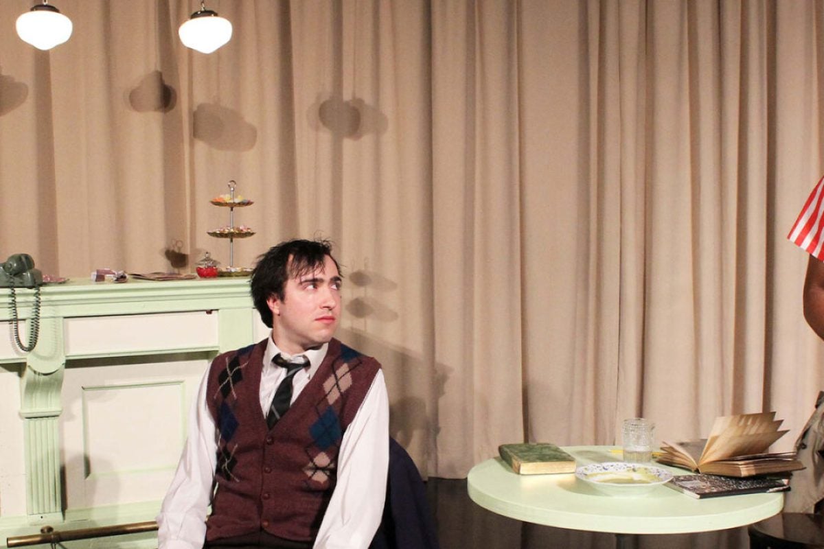 Theater scene: Three actors in a vintage-style production.